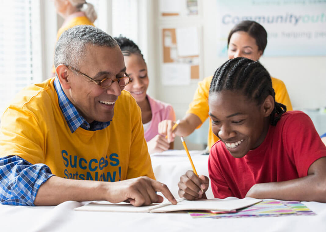 retired man tutoring student - Jose Luis Pelaez Inc/Digital Vision/Getty Images