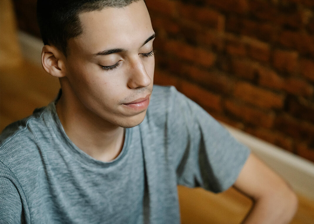 reflective young man with eyes closed - photo by Eren Li on Pexels