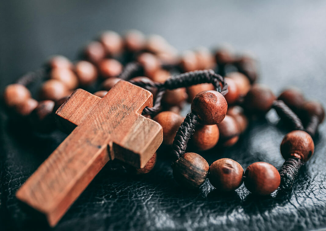 wood rosary - photo by James Coleman on Unsplash